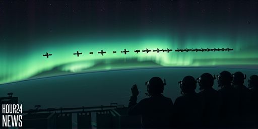 ISS Astronaut Captures Bright Starlink Train Gliding Over Emerald Auroras