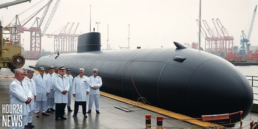 North Korea unveils images of its first nuclear-powered submarine, signaling a major capability leap