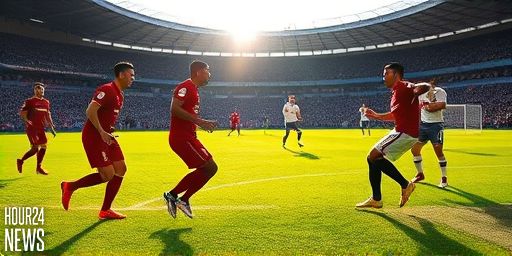 Liverpool cling on to beat nine-man Spurs after chaotic clash as Isak injured